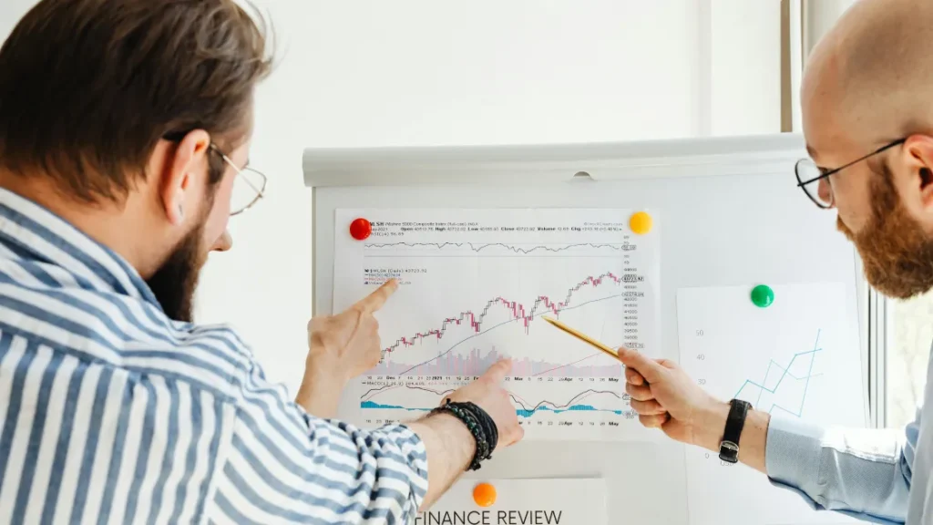 Employees discussing is it time to end annual performance evals & merit increases?