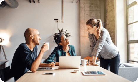 Managers discussing merit cycle strategy during compensation planning session
